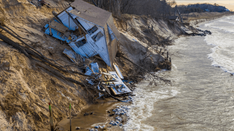 Collapsed beach house on an eroding bluff along the shore of Lake Michigan near Montague, Michigan.