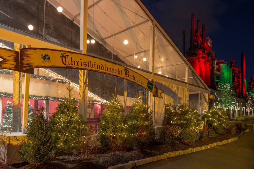 Christkindlmarkt in Bethlehem, Pennsylvania at night, with illuminated Christmas trees and market tents