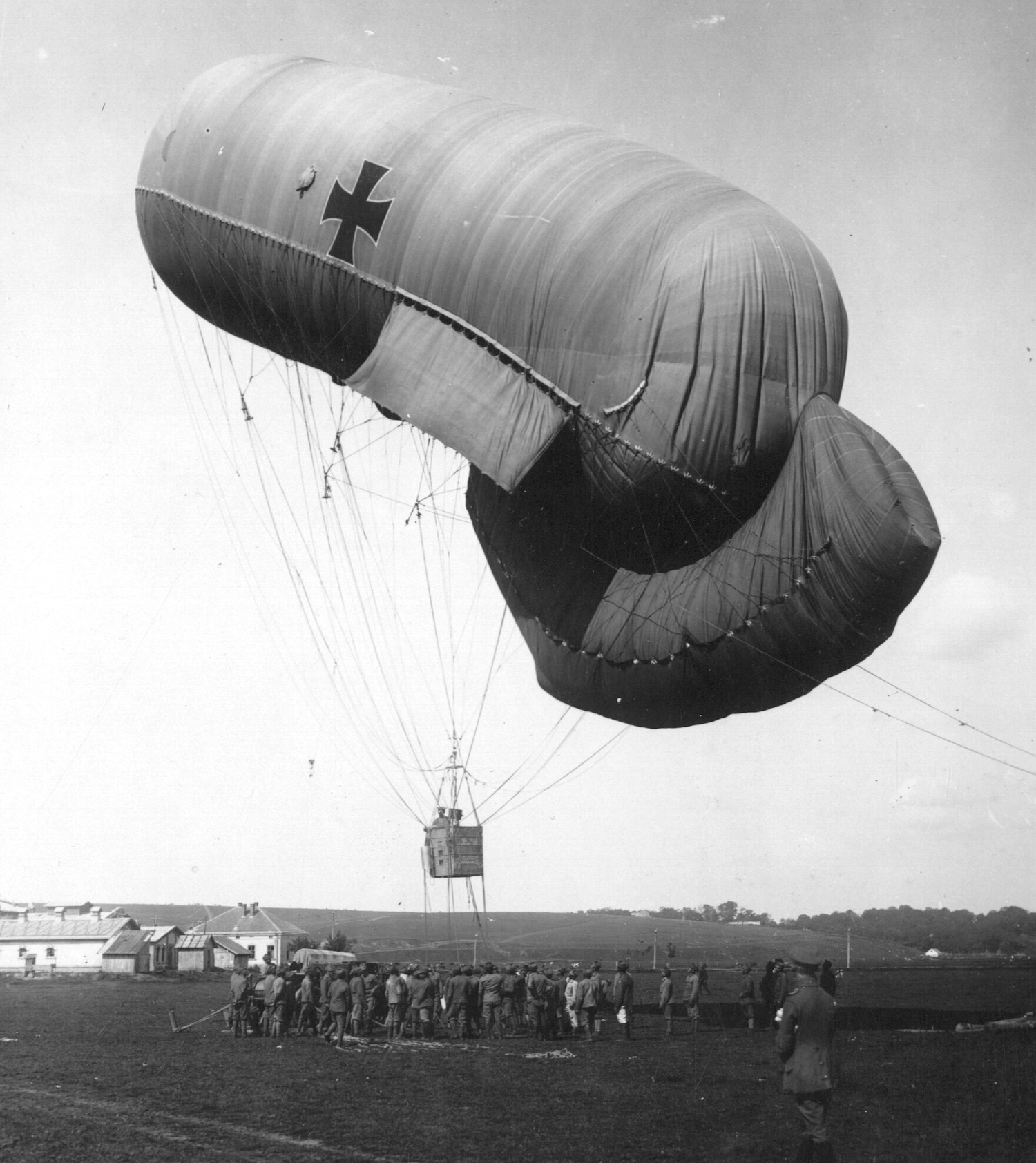 Austro-Hungarian Drachenballon observation balloon tethered above a ground crew, with stabilizing lobes visible, World War I, 1917.