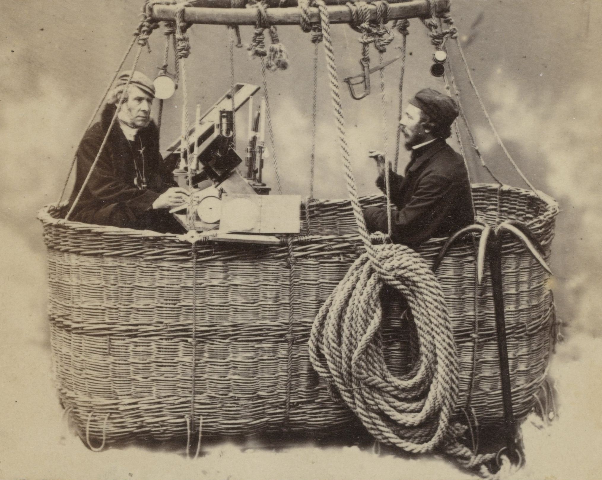 James Glaisher and Henry Tracey Coxwell in the basket of a tethered balloon with scientific instruments, 1864.