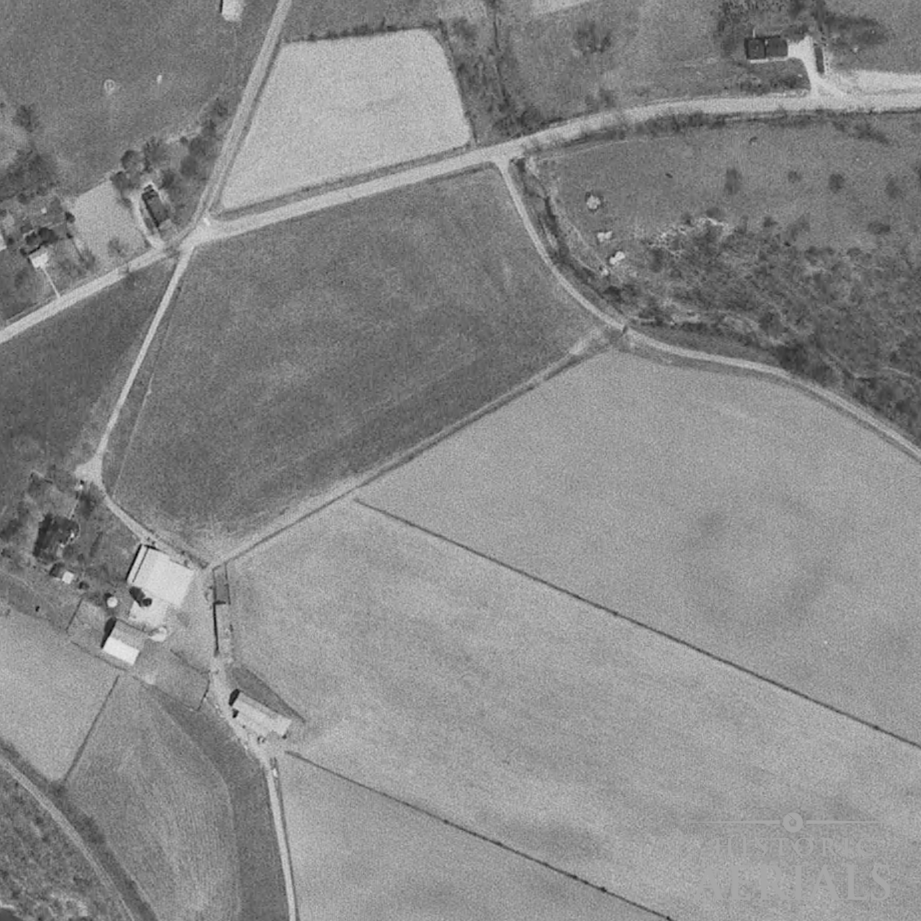 Historic aerial image of farmland and road alignments near the Junction Earthworks site in Ross County, Ohio, showing landscape conditions in 1971.