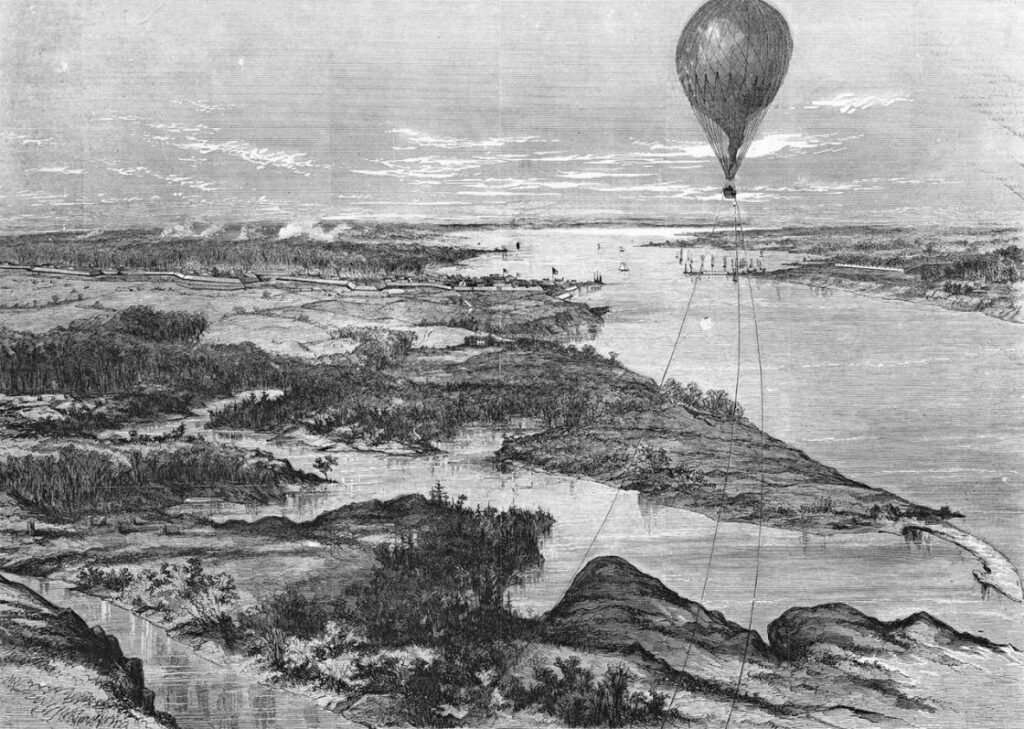 Illustration of a tethered military observation balloon hovering above a river landscape during the Peninsula Campaign of the American Civil War.