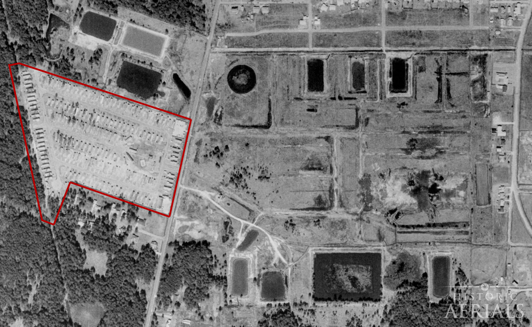 1973 aerial image showing a trailer park built over former oil storage pits in Humble, Texas.
