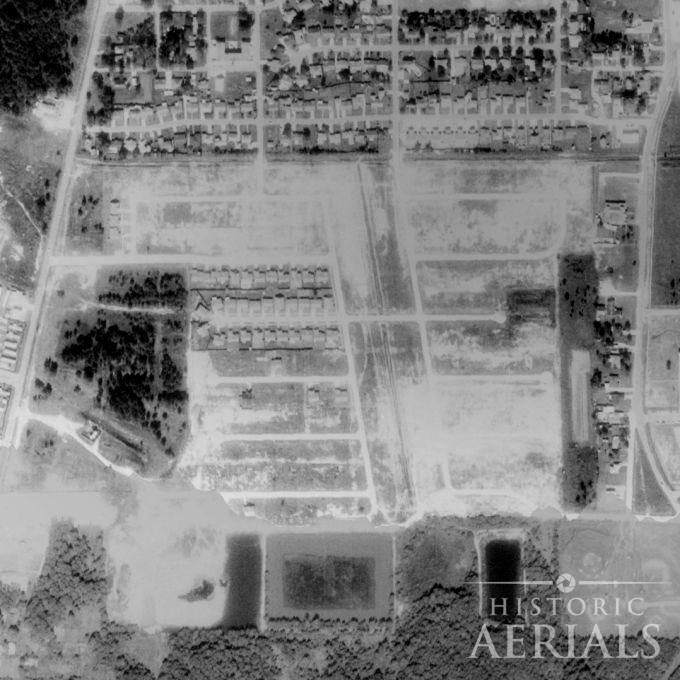 1981 aerial view showing newly laid residential streets over former oil tank pit area in Humble, Texas.