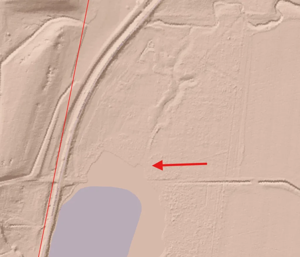 LiDAR hillshade north of Cuylerville, New York, with a red arrow marking a faint channel trace leading north from a pond.